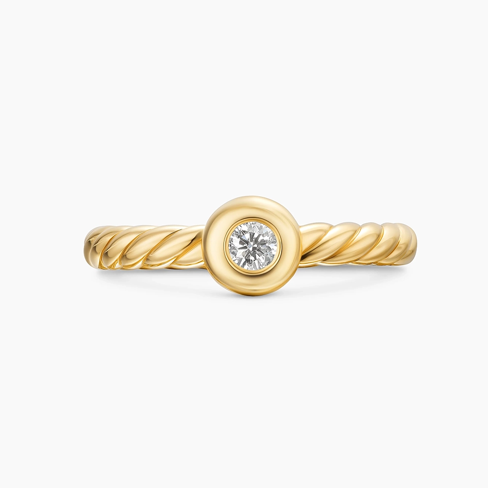 Side profile of the Petite Cable Ring, emphasizing the smooth band and the subtle setting of the 2.8mm center diamond.