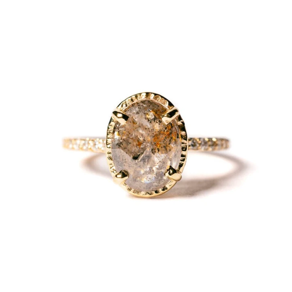 The Destiny engagement ring worn on hand, illustrating its bold design and the sparkling pave diamonds set in the 14k yellow gold band.