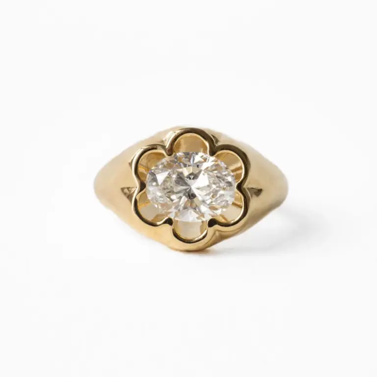 Flora East-West Oval Ring by June Rings featuring a 1.75-carat oval center stone in a petal bezel setting on a chunky 14k gold band