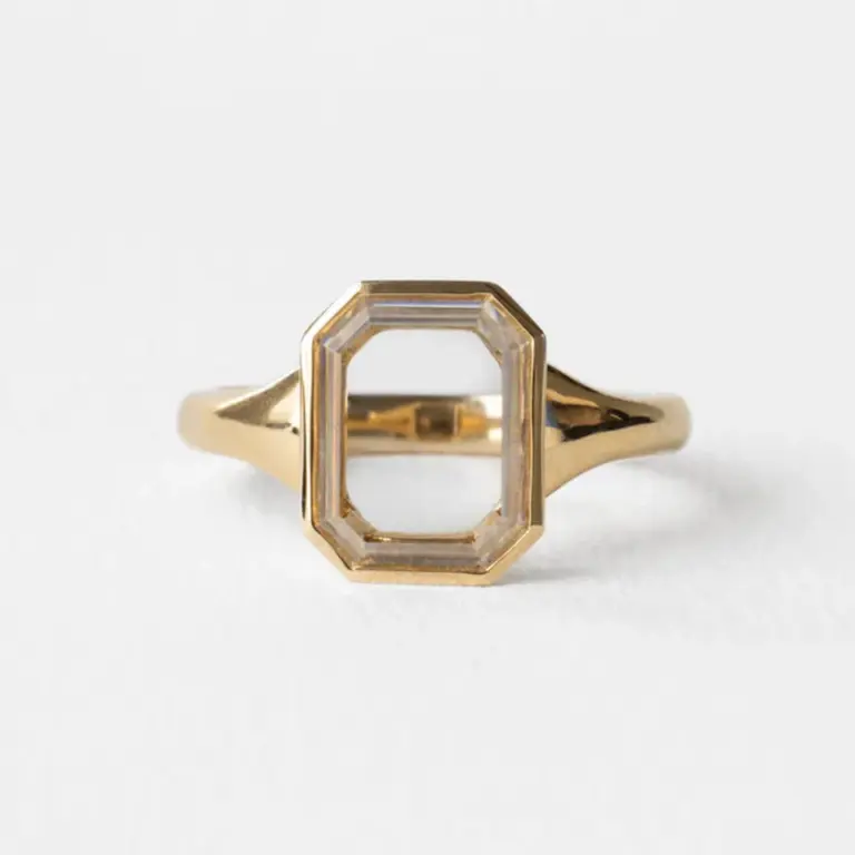 Detailed view of the Maren Portrait Bezel Emerald Ring's underside, showcasing the craftsmanship and solid gold construction.