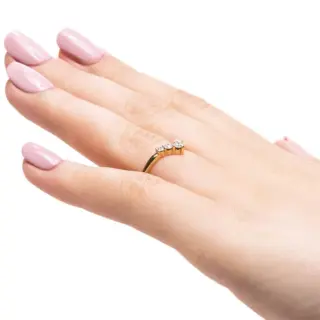 Diamond V Wedding Band in 14K yellow gold modeled on hand—showcasing the elegant V contour and the sparkle of graduated accent diamonds