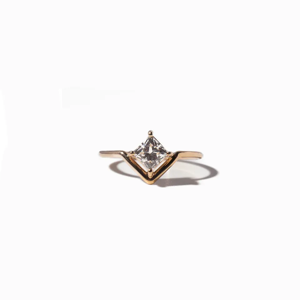 Minimalist 14k gold ring featuring a princess cut diamond set in a unique nestled design by Wwake