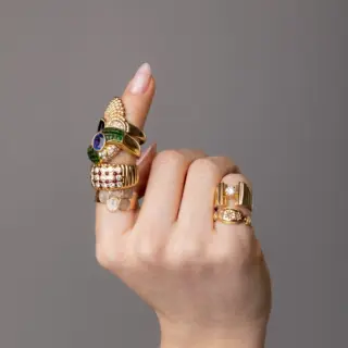 Side profile of Royal Ring showing ribbed yellow gold silhouette and alternating ruby and diamond stones set flush for a textured, dimensional effect