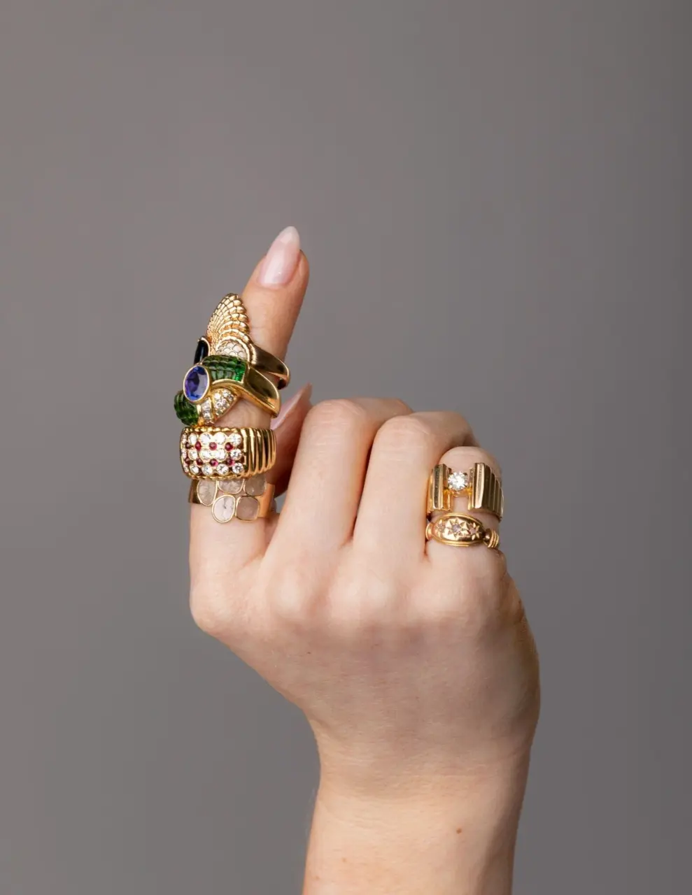 Side profile of Royal Ring showing ribbed yellow gold silhouette and alternating ruby and diamond stones set flush for a textured, dimensional effect