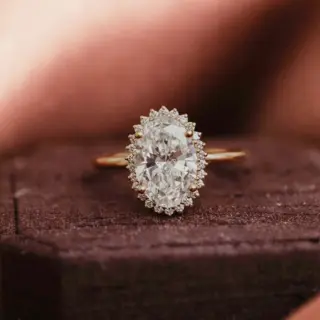 Nova Oval Ring by Sarah O. Jewelry featuring a 1.0ct lab-grown oval diamond with a starburst diamond halo in 14k rose gold