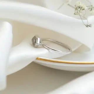 Minimalist 14 k white gold ring with a grey, hexagon-shaped 1.21 ct rustic diamond bezel-mounted east‑west