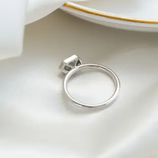 Delicate 1.8 mm white gold band showcasing a hexagon-cut rustic diamond bezel-set horizontally