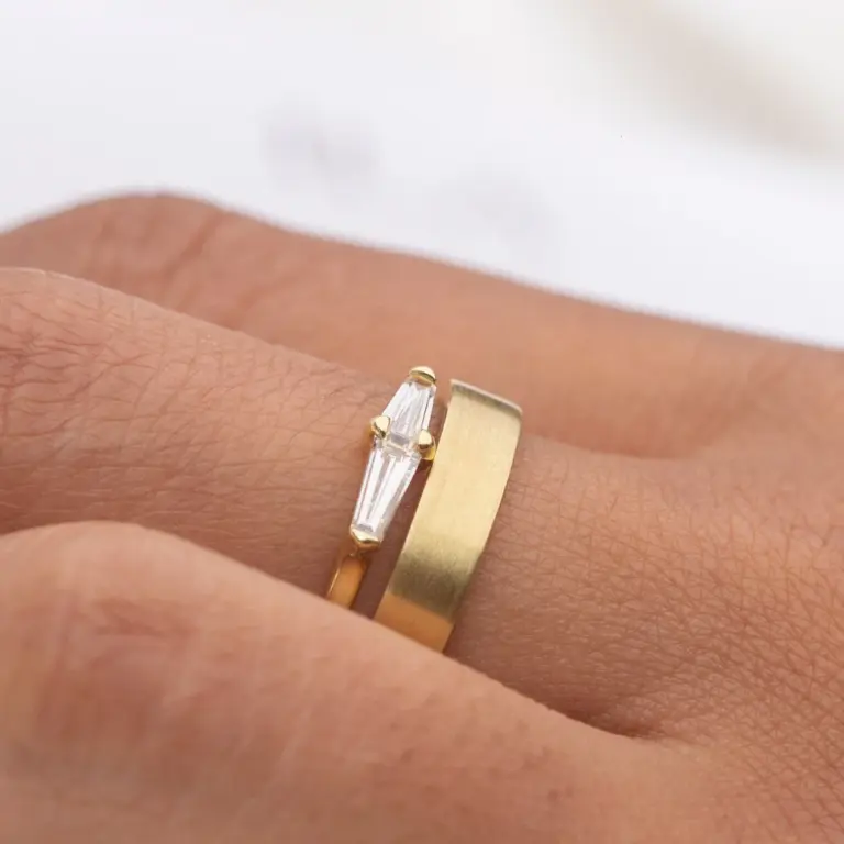 Model wearing the Perryn baguette diamond ring, emphasizing its minimalist design and diamond details