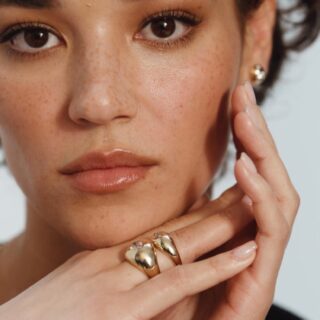 Modern vintage-inspired ring: 1.0 ct oval VRAI created diamond set in a 10 mm 14K yellow gold domed band.