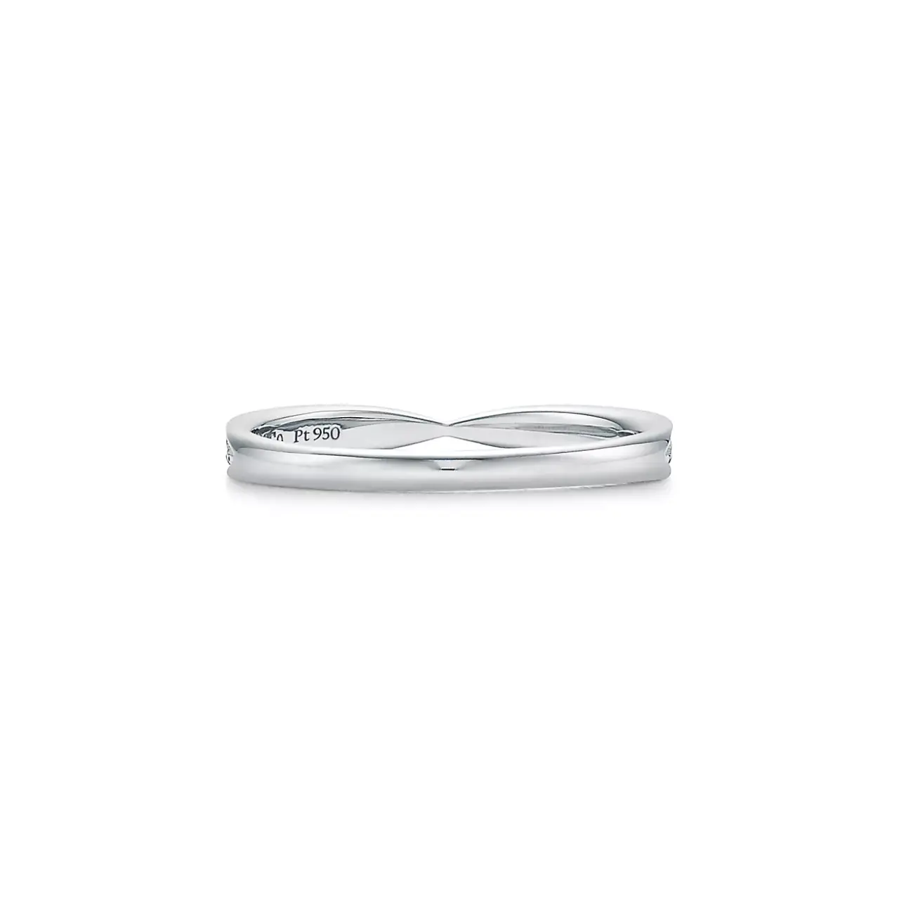 Detailed view of the Tiffany Harmony® band ring’s surface, emphasizing the smooth finish of platinum and diamond sparkle.