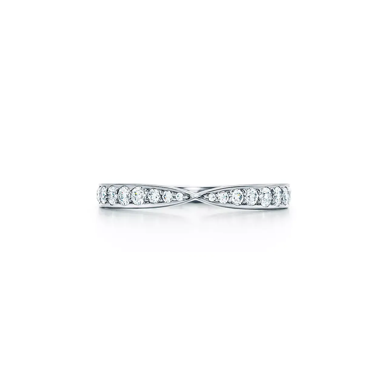 Close-up of Tiffany Harmony® platinum band ring showing bead-set round brilliant diamonds on a gently tapered 1.8 mm band.