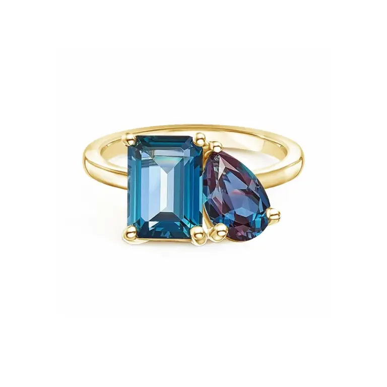 oi et Moi cocktail ring featuring a 10x7mm emerald-cut London Blue topaz and a 9x6mm pear-shaped lab-grown alexandrite, set in 18K yellow gold