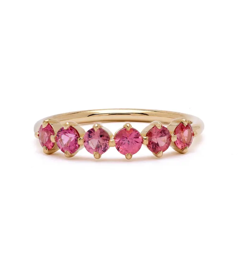 Side profile of the Claudette 5-Stone Oval Hot Pink Spinel Ring, emphasizing the smooth band and the elegant setting of the pink spinels.
