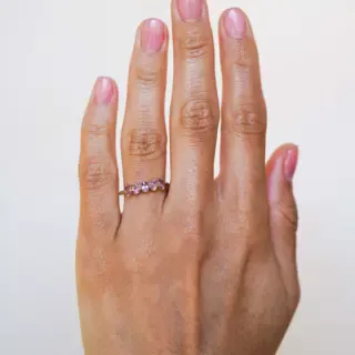 Side profile of the Claudette 5-Stone Oval Hot Pink Spinel Ring, emphasizing the smooth band and the elegant setting of the pink spinels.