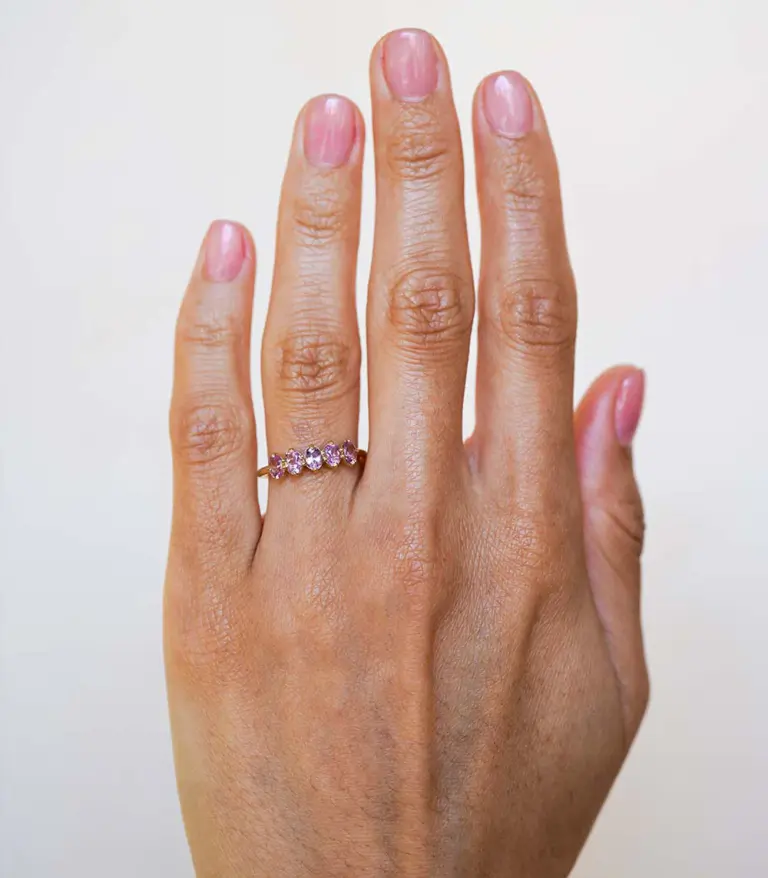 Side profile of the Claudette 5-Stone Oval Hot Pink Spinel Ring, emphasizing the smooth band and the elegant setting of the pink spinels.